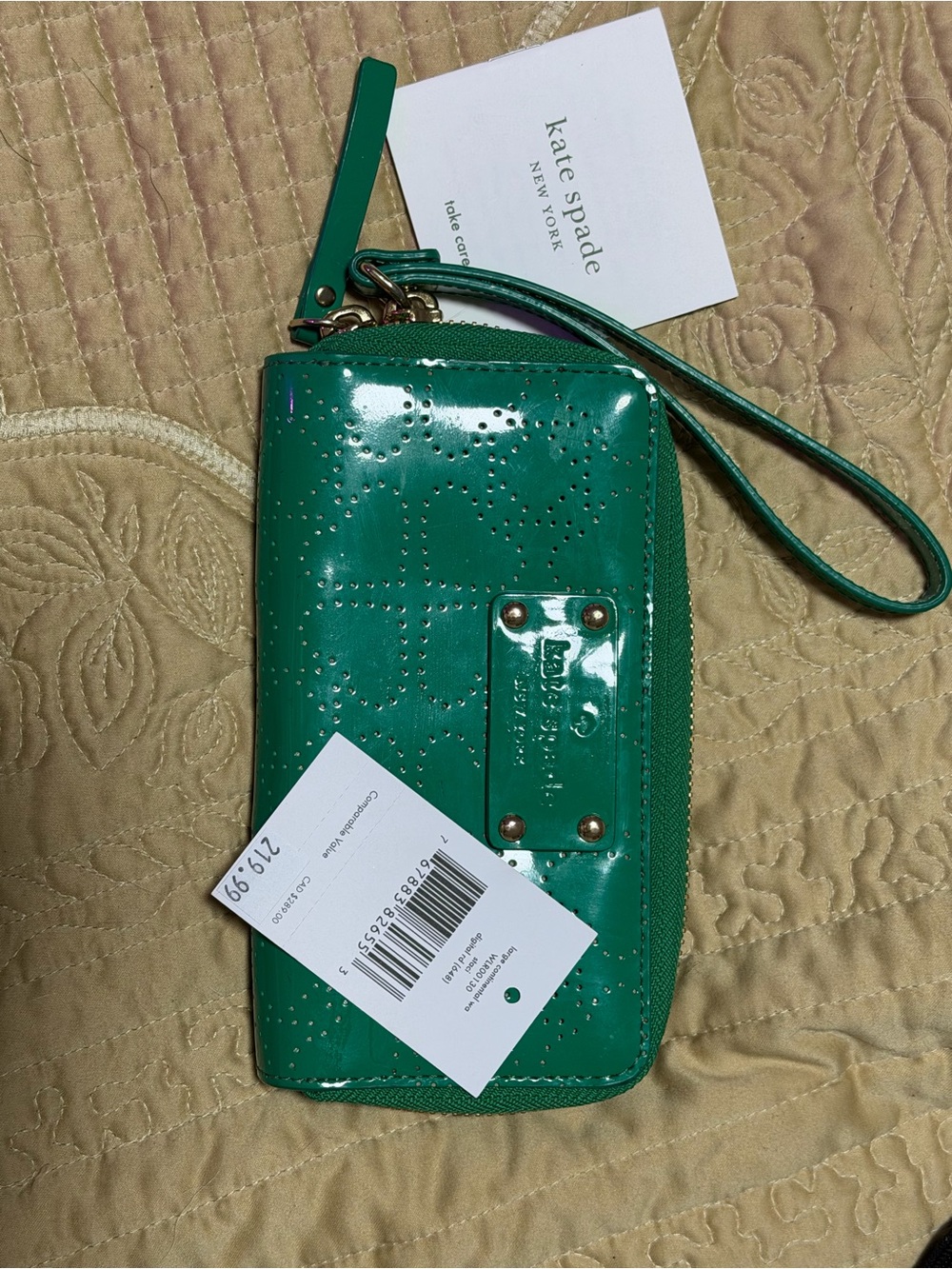 kate spade teal patent leather wristlet with perforated design
